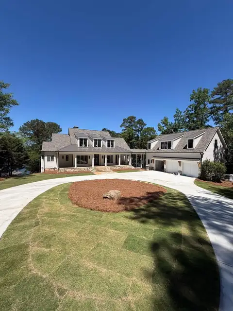 Circular drive with a mulched island and fresh sod