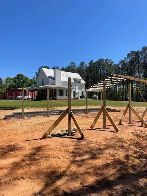 Barn posts set on the finished pad