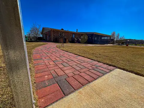 Paver walk meeting the concrete drive