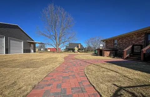 Walkway curving across the yard