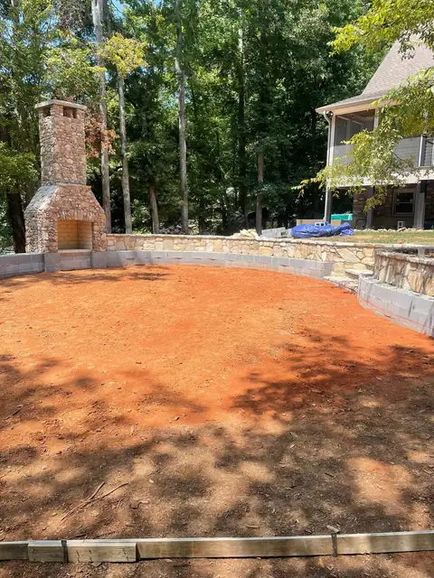 Patio area graded and formed, with the fireplace going up