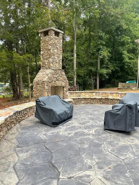 Fireplace and seating wall around the patio