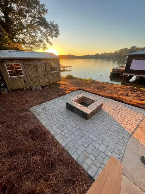 The patio from above, between the shed and the shoreline