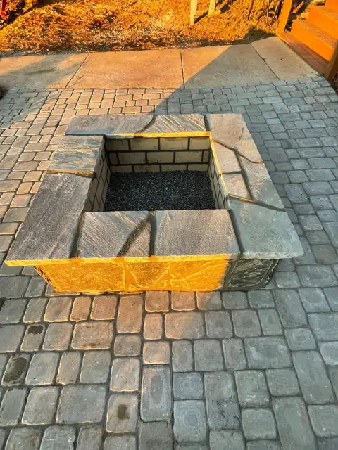Square fire pit set into the paver patio