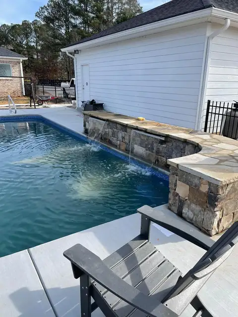 Pool wall and water feature from the patio